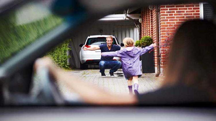 Newly divorced father greets his daughter after her mother drops her off.